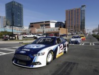 NASCAR Sprint Cup Series champion Brad Keselowski leads a parade of Ford Racing cars through the streets of Charlotte on the fourth and final day of the NASCAR Sprint Media Tour hosted by Charlotte Motor Speedway. (CMS/HHP Photo)