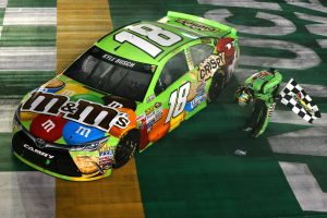 Kyle Busch gives his signature bow to the crowd after winning in Kentucky. Photo: Brian Lawdermilk/NASCAR via Getty Images