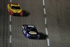 FORT WORTH, TEXAS - APRIL 09: Chase Elliott, driver of the #24 NAPA Auto Parts Chevrolet, leads Joey Logano, driver of the #22 Shell Pennzoil Ford, during the NASCAR Sprint Cup Series Duck Commander 500 at Texas Motor Speedway on April 9, 2016 in Fort Worth, Texas. (Photo by Tom Pennington/Getty Images)