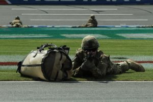 The US Army's 82nd Airborne rappelling onto the front stretch at Charlotte Motor Speedway. Photo Credit: Noel Lanier