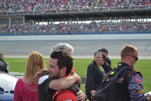 Jeremy Clements receives a hug from his Dad after a series career-best fourth place finish at Talladega, April 30, 2016 - Photo Credit: Jason Watson
