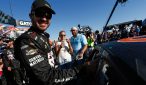 Martin Truex Jr. applies the winners sticker to the side of his car following his victory in the Teenage Mutant Ninja Turtles 400 at Chicagoland Speedway. Photo: Jeff Zelevansky/NASCAR via Getty Images